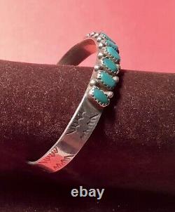 A vintage sterling silver Fred Harvey turquoise bracelet. Excellent condition