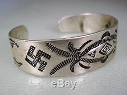 EARLY 1920s FRED HARVEY ERA NAVAJO STAMPED SILVER BRACELET with Whirling Logs
