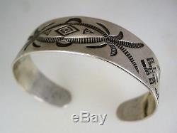 EARLY 1920s FRED HARVEY ERA NAVAJO STAMPED SILVER BRACELET with Whirling Logs