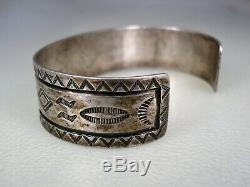EARLY FRED HARVEY / NAVAJO STAMPED STERLING SILVER BRACELET with Whirling Logs