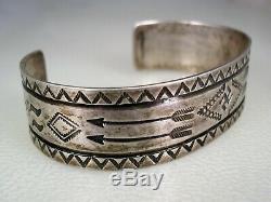 EARLY FRED HARVEY / NAVAJO STAMPED STERLING SILVER BRACELET with Whirling Logs