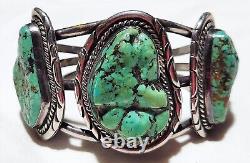 Bracelet manchette en argent de monnaie de l'ère Fred Harvey avec turquoise en gros nugget et motif de toile d'araignée navajo