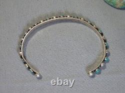 Ère Fred Harvey ZUNI Nevada TURQUOISE Bracelet en argent de monnaie aux yeux de serpent et aux nombreux yeux