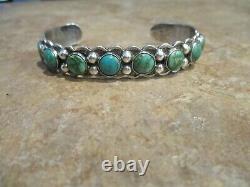 Fabuleux Vieux Fred Harvey Era Navajo Sterling Silver Eight Turquoise Row Bracelet